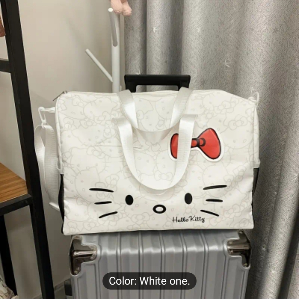 Sanrio Hello Kitty travel bag. Color: White with grey Hello Kitty designs throug